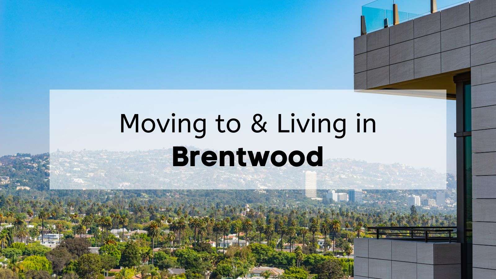 A scenic view of Brentwood and West Los Angeles from a high vantage point, showing palm tree–lined residential neighborhoods framed by rolling hills in the background and a modern building balcony in the foreground under a clear blue sky.