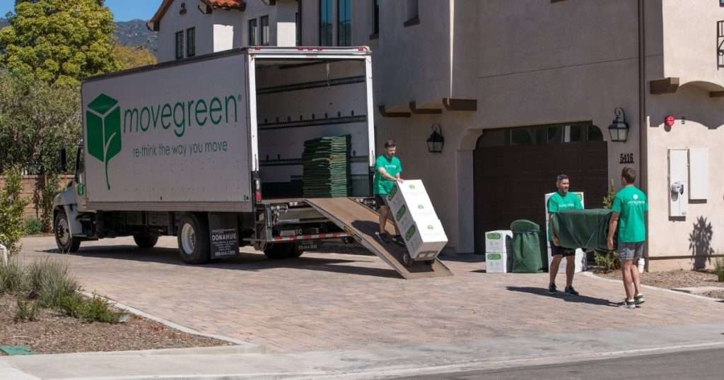 Three furniture movers from a moving company in Sun Valley unloading a truck